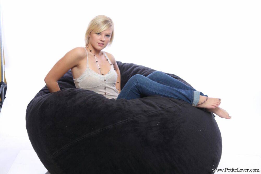 Blonde amateur models non nude on a bean bag chair in blue jeans - #11