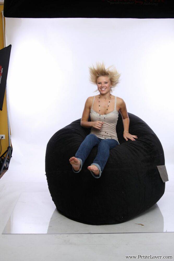 Blonde amateur models non nude on a bean bag chair in blue jeans - #7