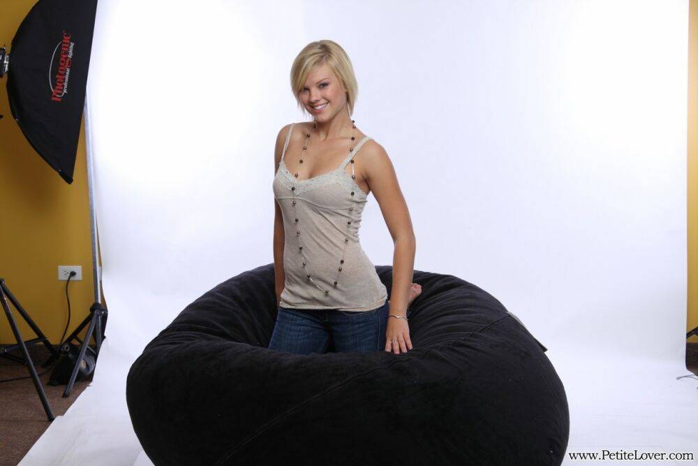 Blonde amateur models non nude on a bean bag chair in blue jeans - #8