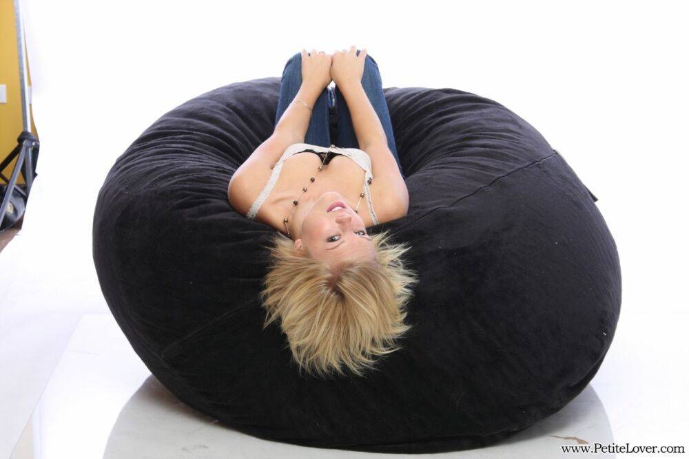 Blonde amateur models non nude on a bean bag chair in blue jeans - #13