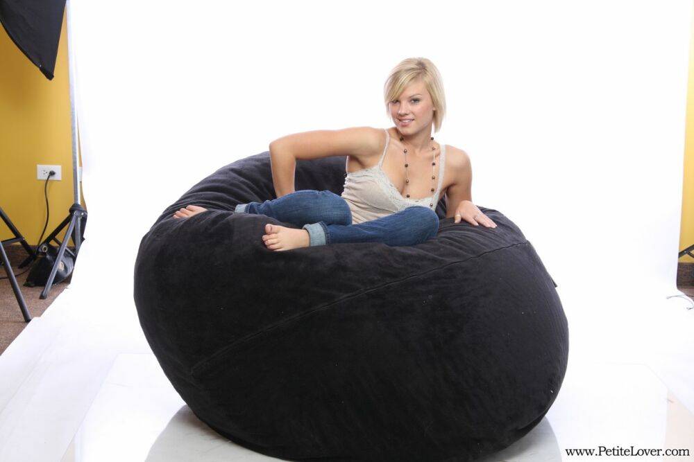 Blonde amateur models non nude on a bean bag chair in blue jeans - #3