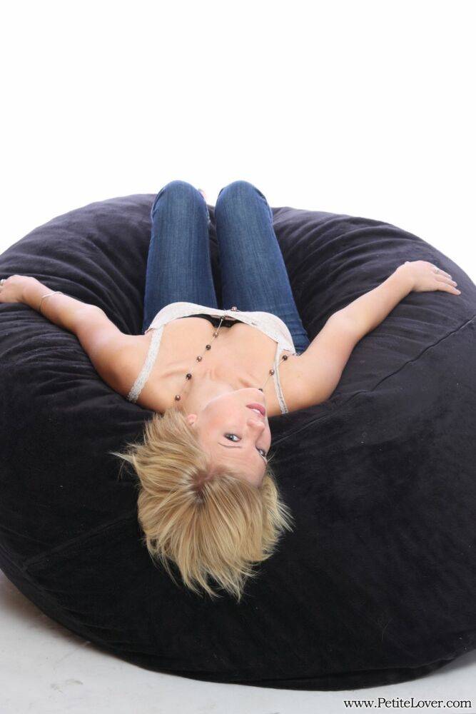 Blonde amateur models non nude on a bean bag chair in blue jeans - #2