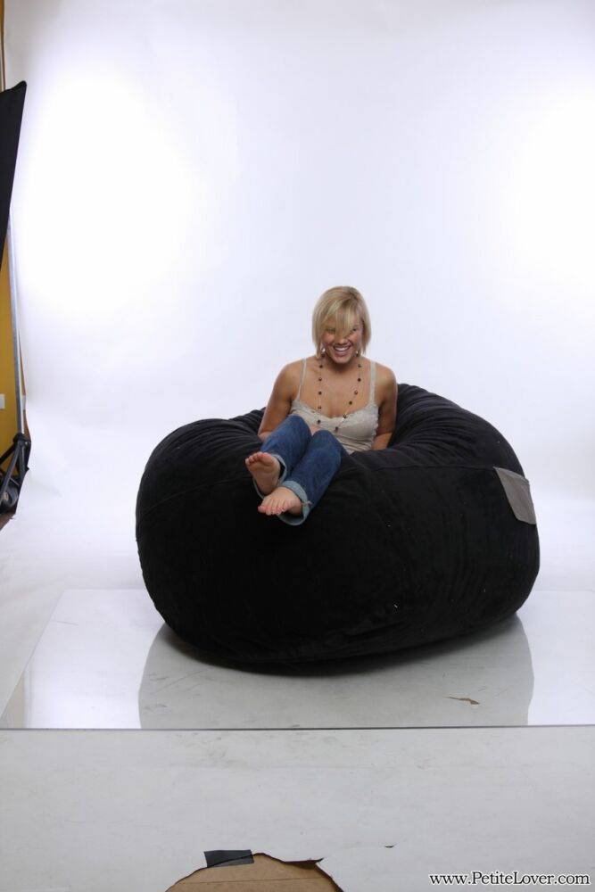 Blonde amateur models non nude on a bean bag chair in blue jeans - #5