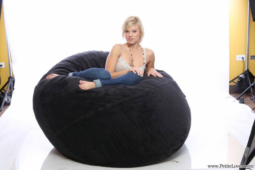 Blonde amateur models non nude on a bean bag chair in blue jeans - #14