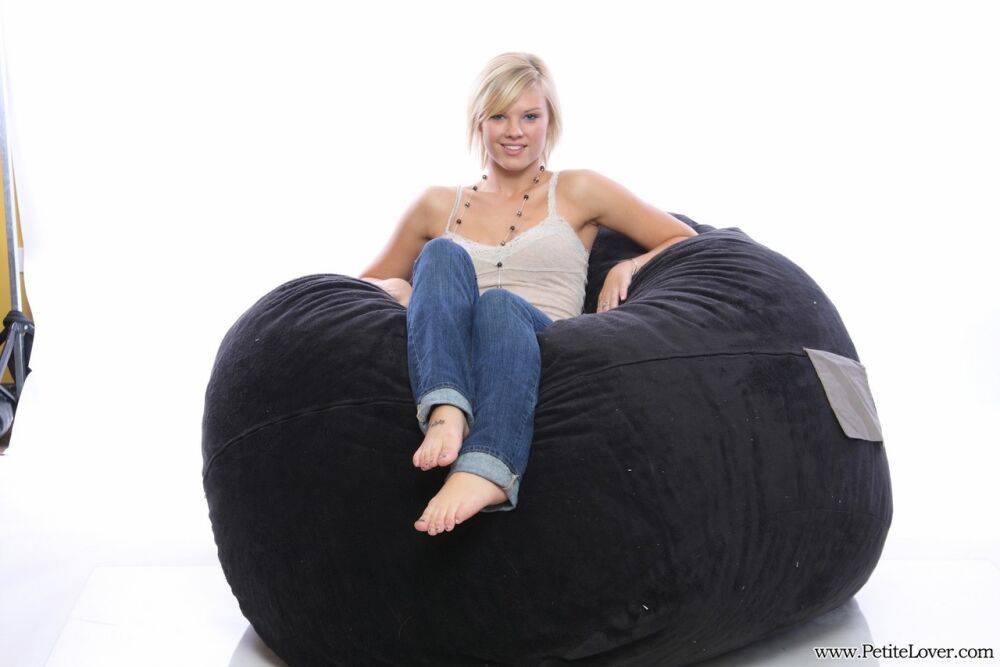 Blonde amateur models non nude on a bean bag chair in blue jeans - #16