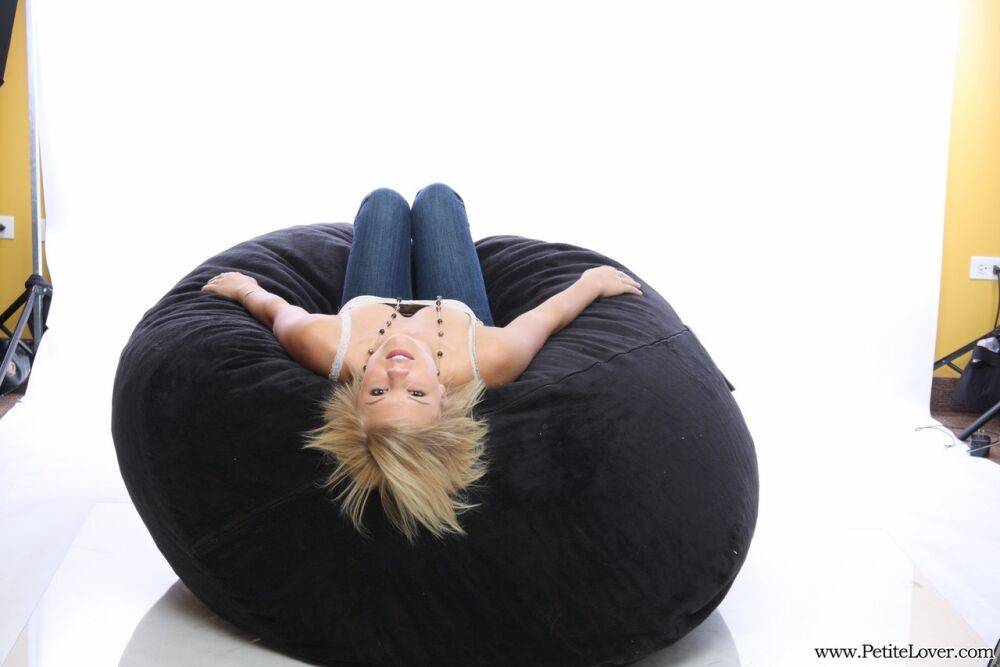 Blonde amateur models non nude on a bean bag chair in blue jeans - #4