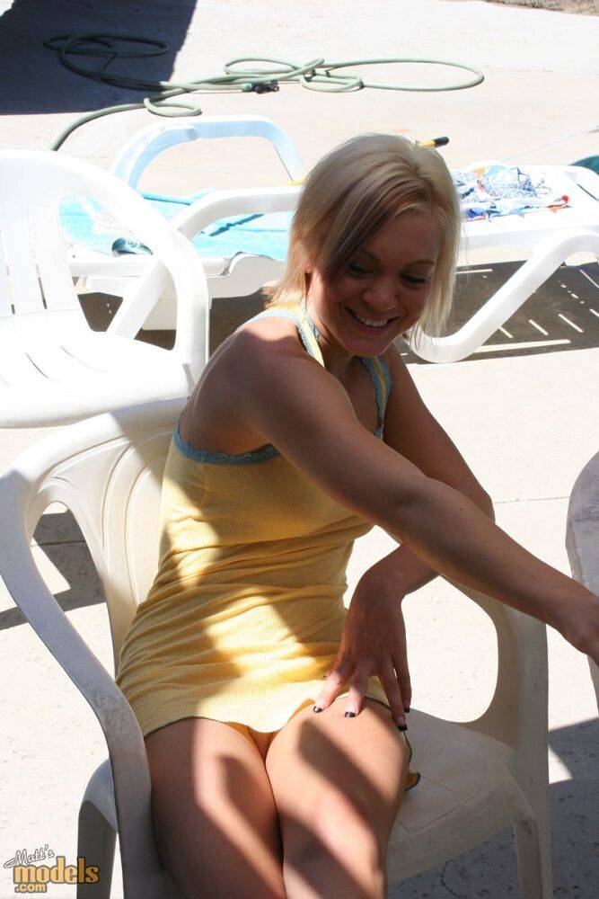 Blonde amateur Princessa smokes a cigarette after posing nude in a pool - #11