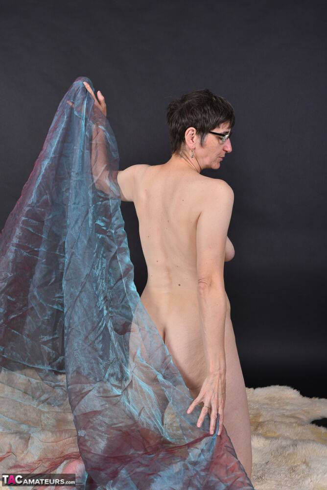 Middle-aged amateur models totally naked while wrapped up in sheer fabric - #10