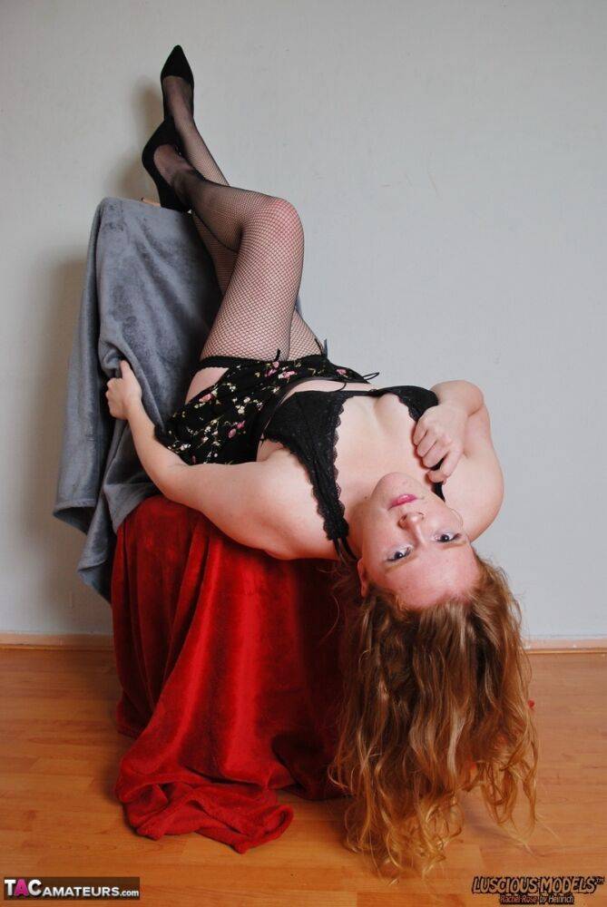 Natural redhead exposes her black underwear during upskirt action in nylons - #3