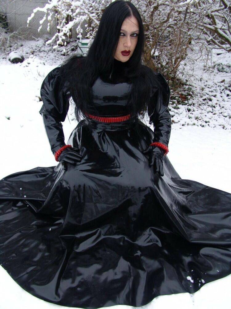 Goth woman Lady Angelina models a black latex dress on snow-covered ground - #2