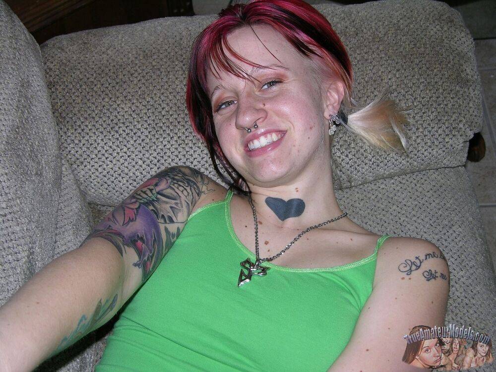 Amateur girl with piercings and dyed hair shows her natural pussy on love seat - #9