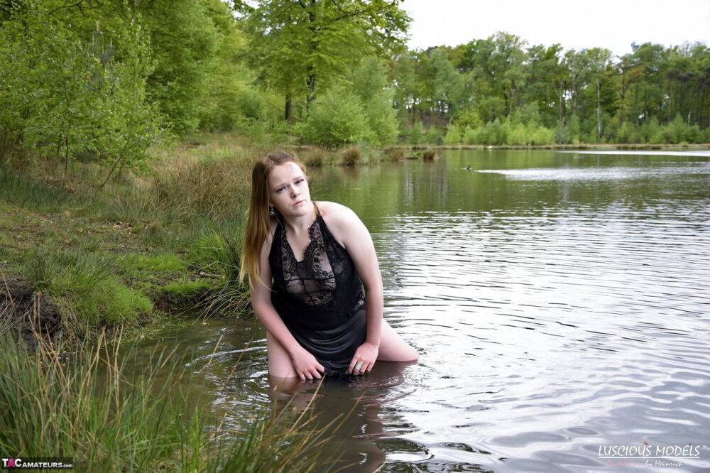 Redheaded amateur Luscious Models models lingerie while in a lake - #1