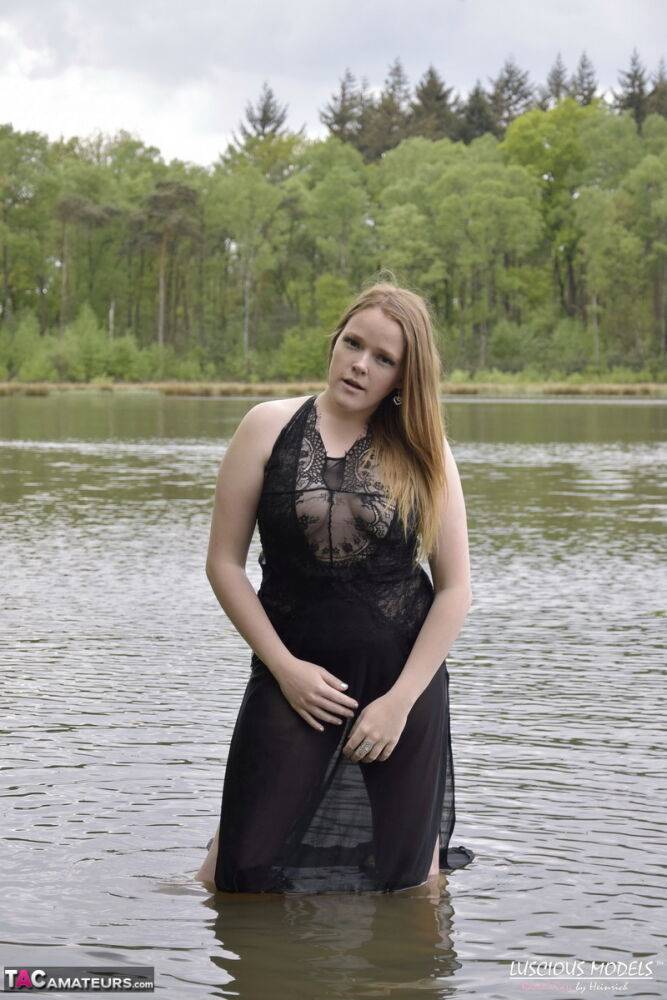 Redheaded amateur Luscious Models models lingerie while in a lake - #14