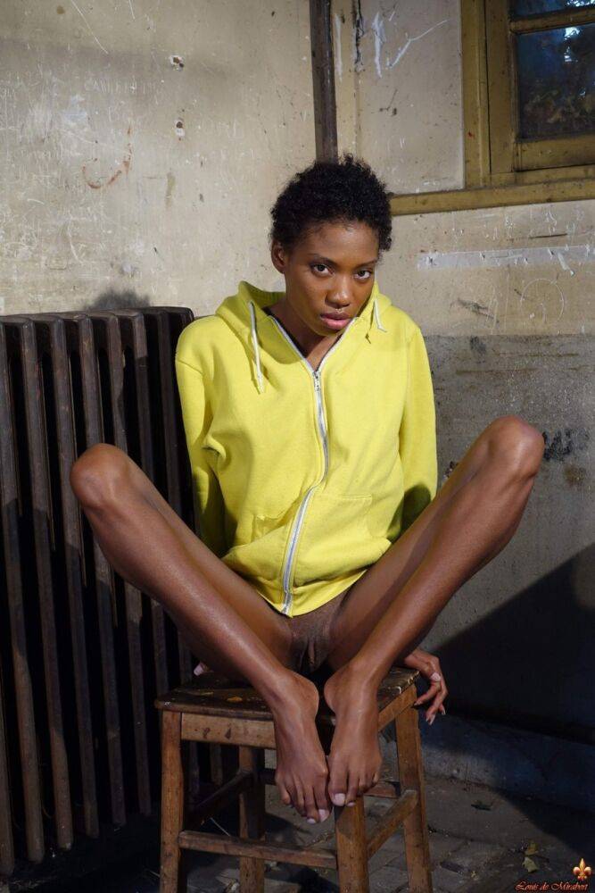 Skinny black girl Jess models totally naked on an ancient radiator - #6