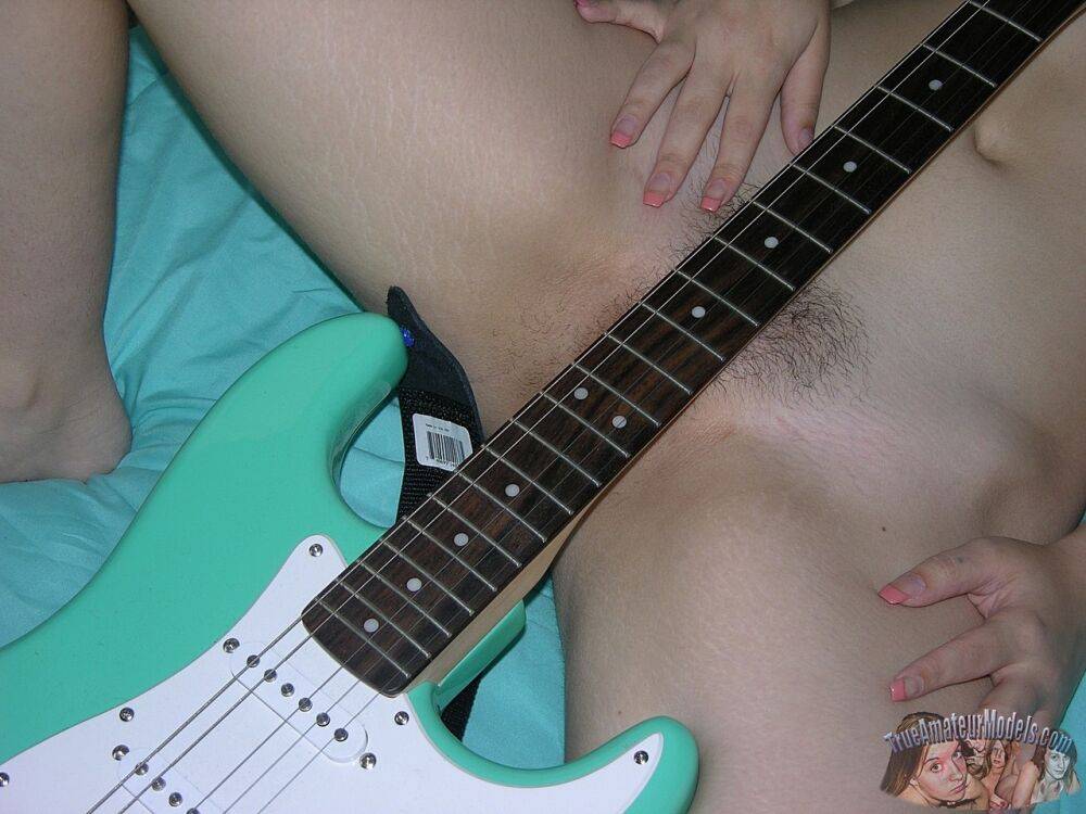 18 year old girl Lenna covers her naked pussy with a guitar after disrobing - #13