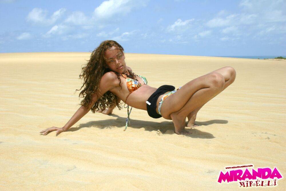 Latina teen Miranda Mirelli models in a bikini atop a sand dune - #11