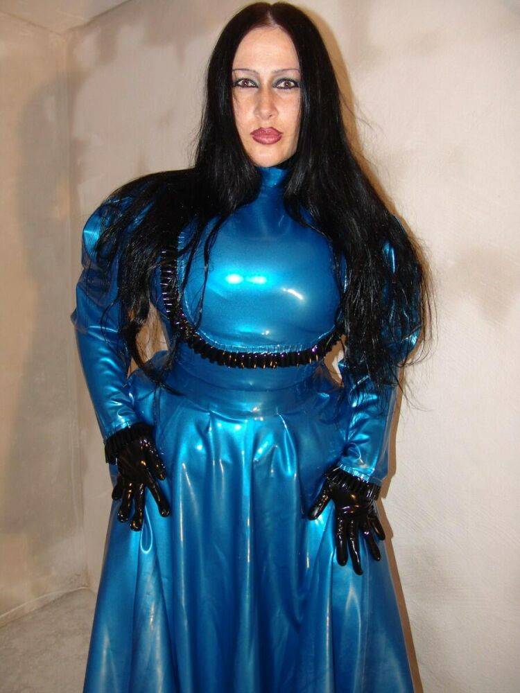 Dark-haired chick Lady Angelina models an amazing latex dress during a SFW gig - #11