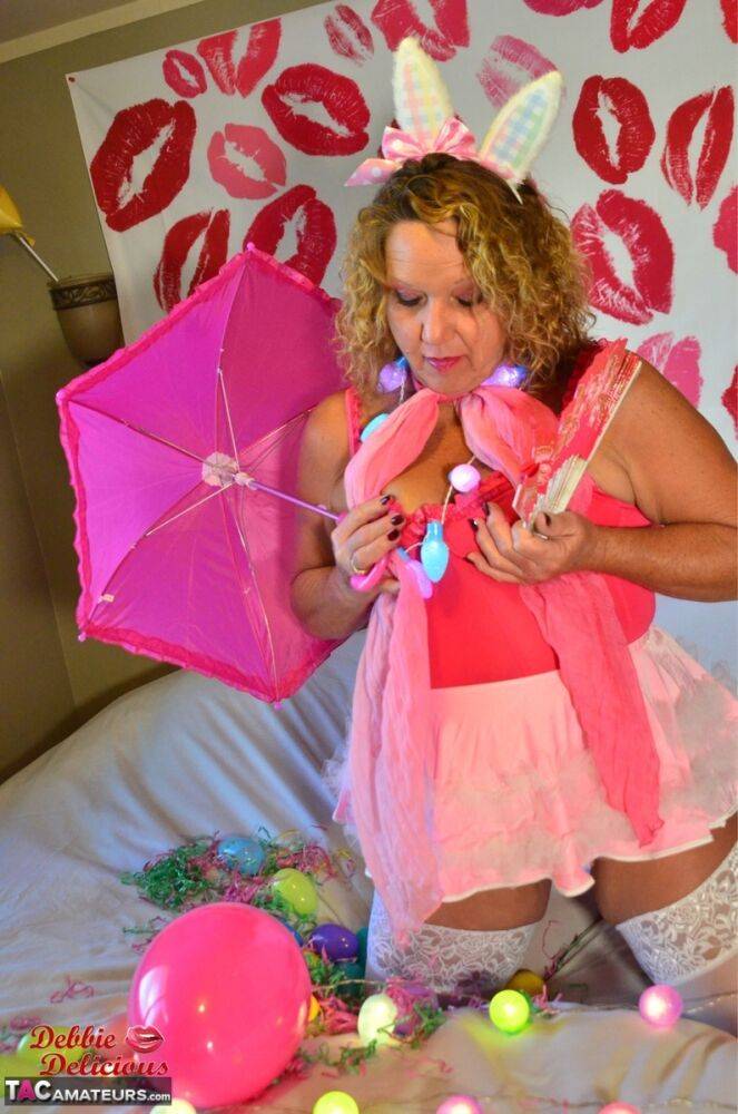 Mature plumper Debbie Delicious models on her bed in cosplay apparel - #2