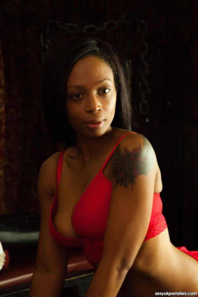 British black girl Lola Marie models red lingerie and matching stockings - #9