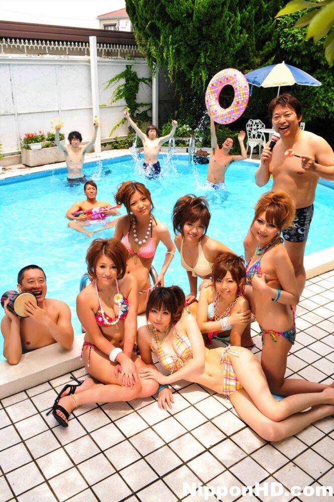 Japanese bikini models gather on a poolside patio for a group shoot - #7