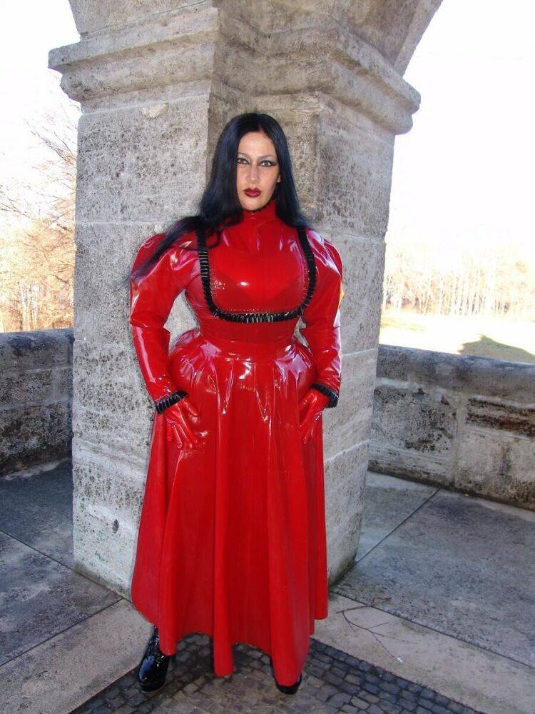 Goth woman Lady Angelina models a red latex dress during non-nude action - #4