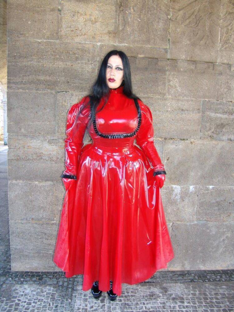 Goth woman Lady Angelina models a red latex dress during non-nude action - #2