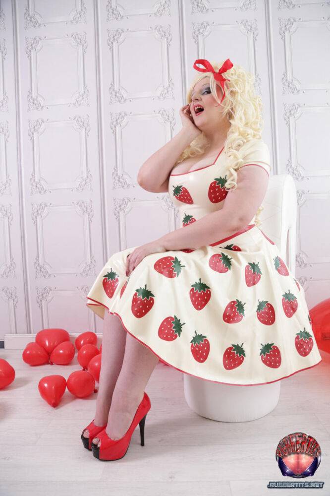 Thick blonde Avengelique models a latex dress in hosiery and red heels - #7