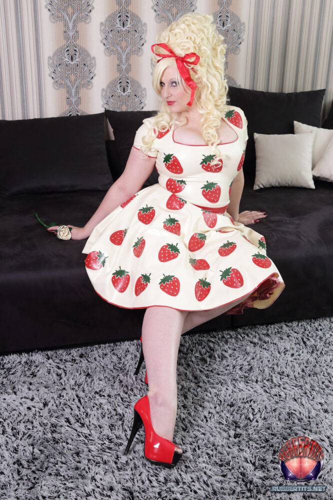 Thick blonde Avengelique models a latex dress in hosiery and red heels - #4