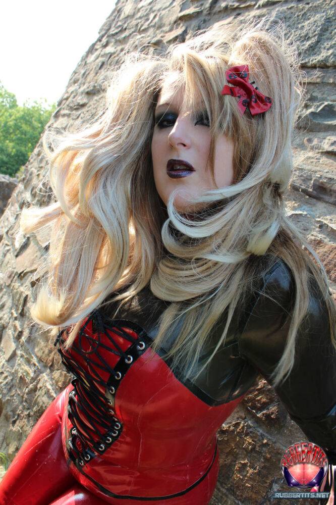 Blonde female models non nude outside Castle ruins in latex clothing and boots - #12