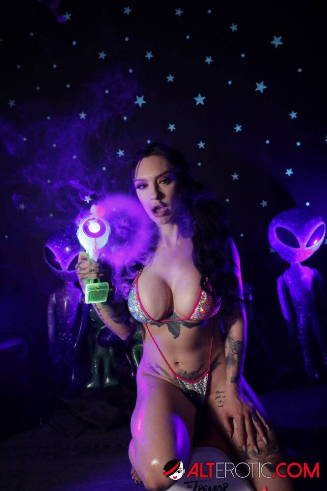 Tattooed brunette Misha Montana models a bikini for a couple of aliens - #10