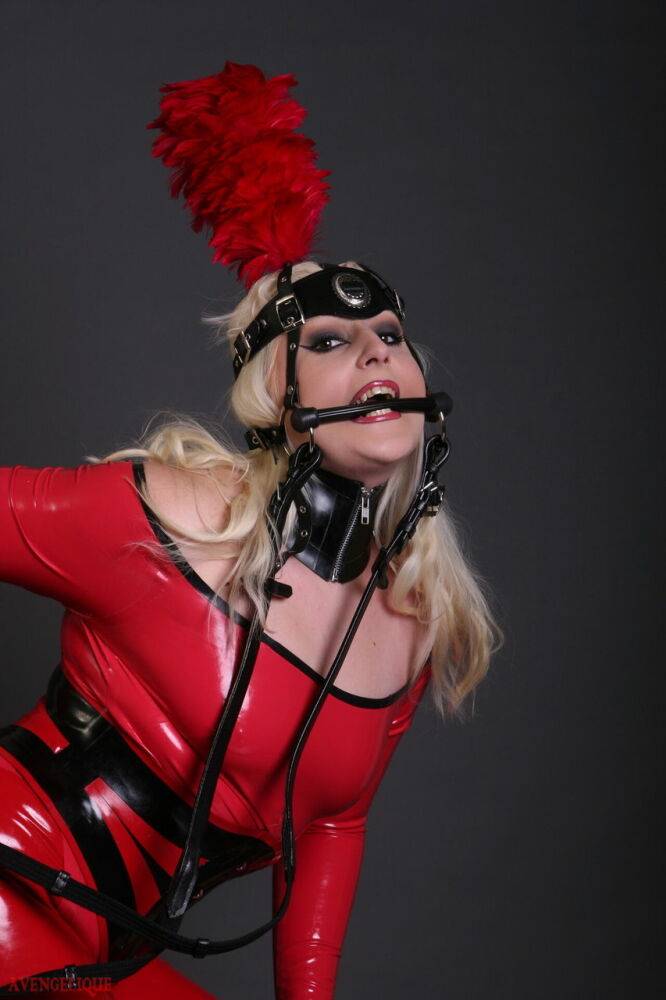 Blonde female models a red latex ponygirl outfit during a non-nude session - #1