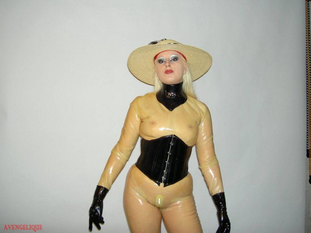 Sexy blonde Avengelique models a sun hat while wearing rubber clothing - #15