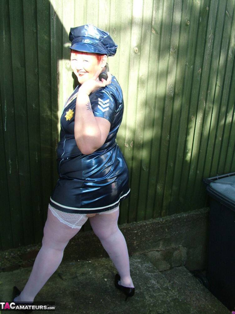 Mature plumper Valgasmic Exposed models latex police attire in white stockings - #14