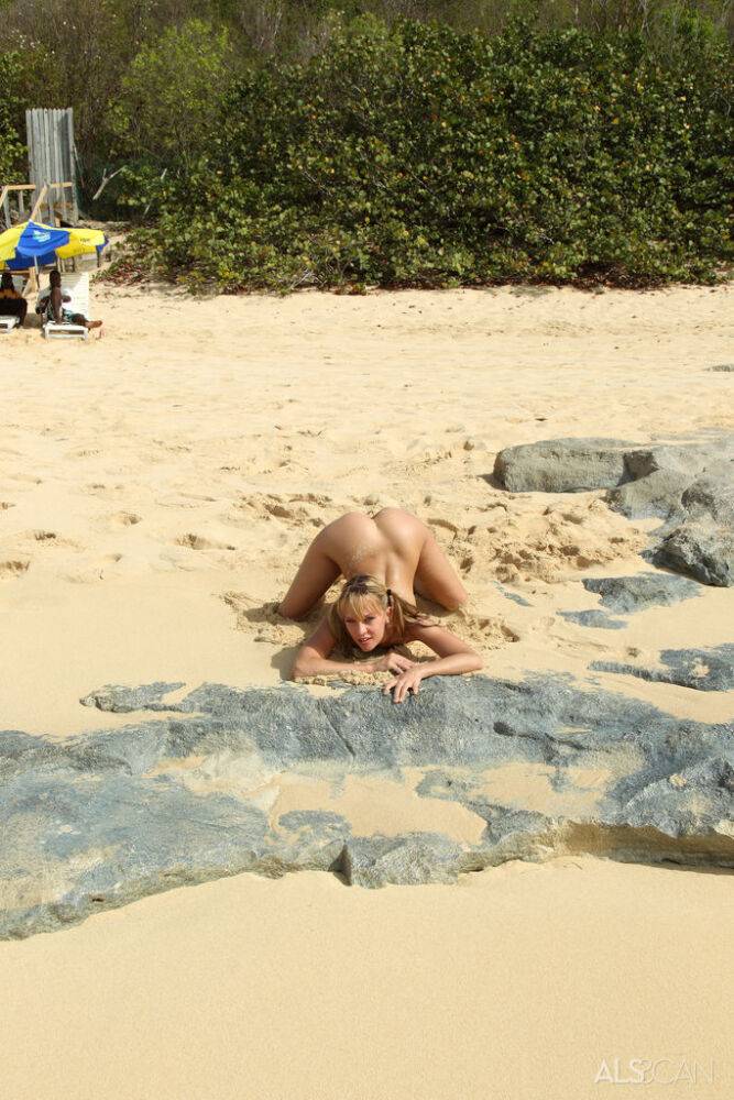 Young blonde girl Blue Angel shows her flexibility and vagina on nude beach - #14