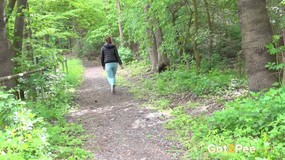 Solo girl Naomi Bennet pulls down her jeans for a piss on a path in the woods - #7