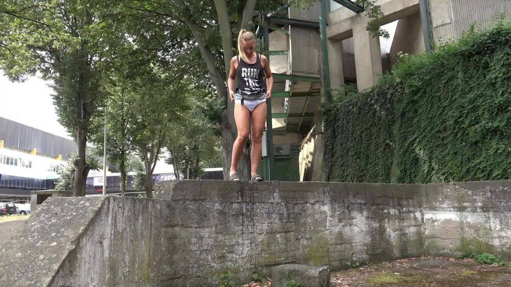 Solo girl Naomi Bennet takes a piss in public while wearing a miniskirt - #7