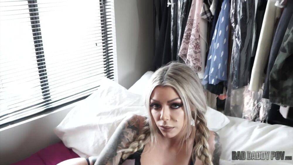 Tattooed blonde takes the braids out of her hair before showing her fake tits - #4