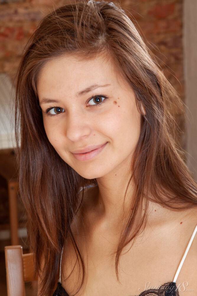 Sweet 18-year-old Irina J gets completely naked on a wooden chair - #16