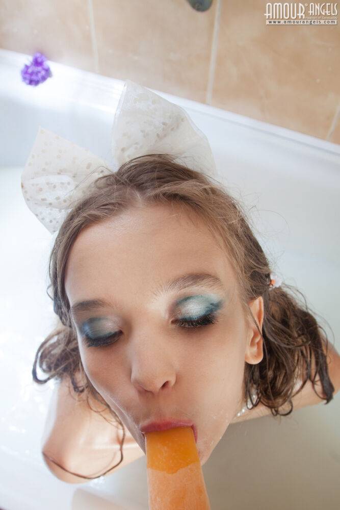 Tiny teen girl Alisabelle pours milk over her naked body while taking a bath - #9