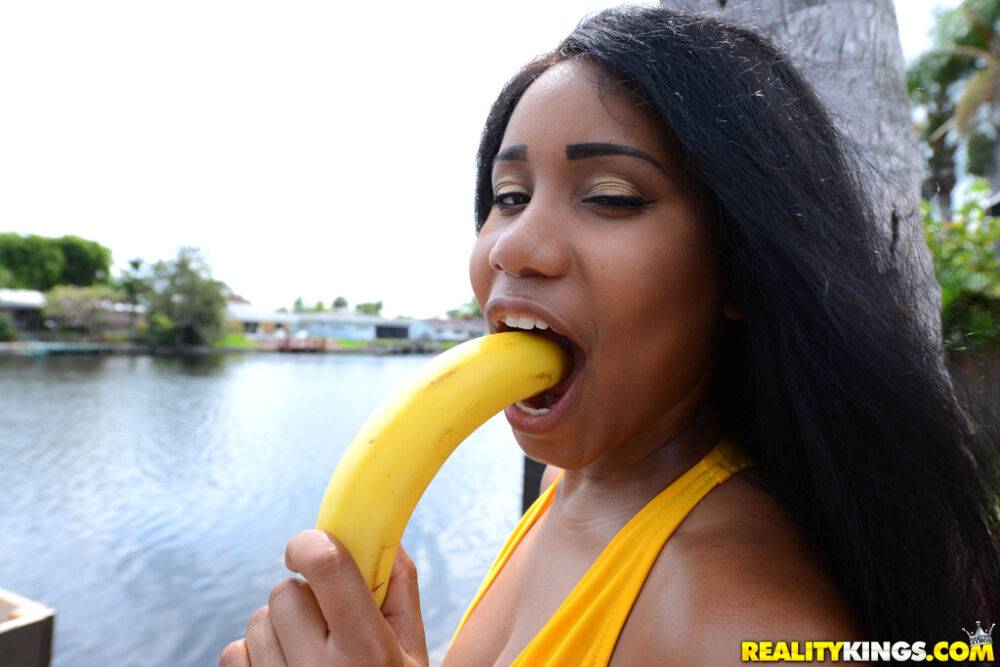 Black chicks Tara Fox and Indigo Vanity suck on bananas attired in swimsuits - #1