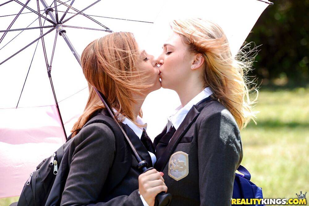 Young schoolgirls Cali Sparks and Kelly Greene tongue kissing outdoors - #15