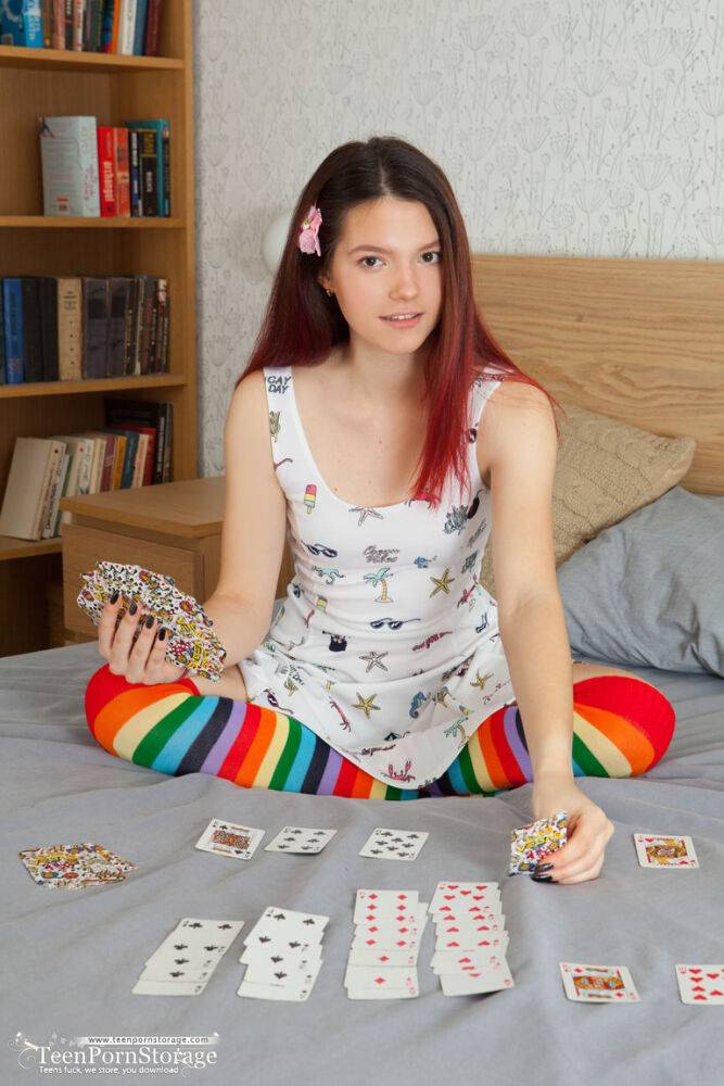 Young looking redhead Diana removes striped OTK socks to pose fully naked - #15