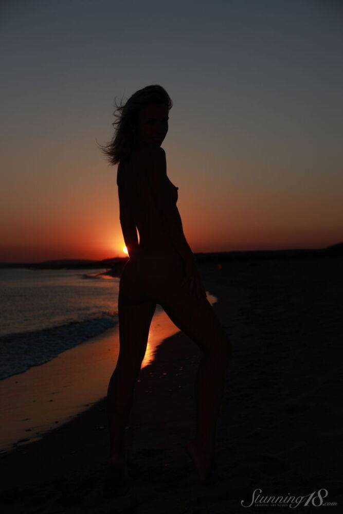 Young blonde Nicole V gets completely naked on a beach at sunset - #11