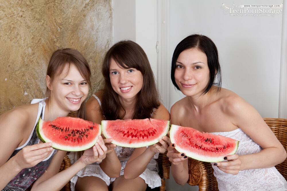 Three young girls cover their naked body in seeds while eating a watermelon - #5