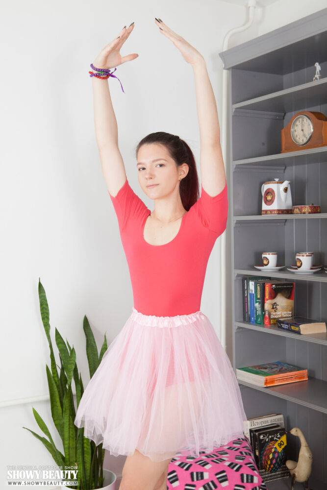 Young looking redhead Diana doffs a tutu while getting naked on a comforter - #8