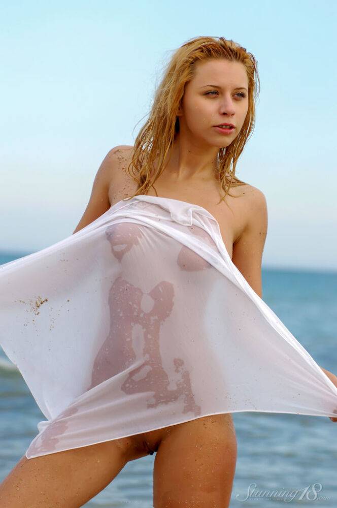 18-year-old strawberry blonde Pyrena V poses nude in the ocean - #13