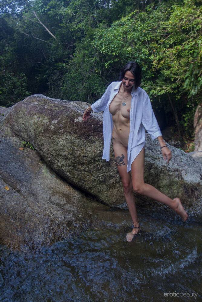 Beautiful teen Alisa M models naked in a pool below a waterfall - #4