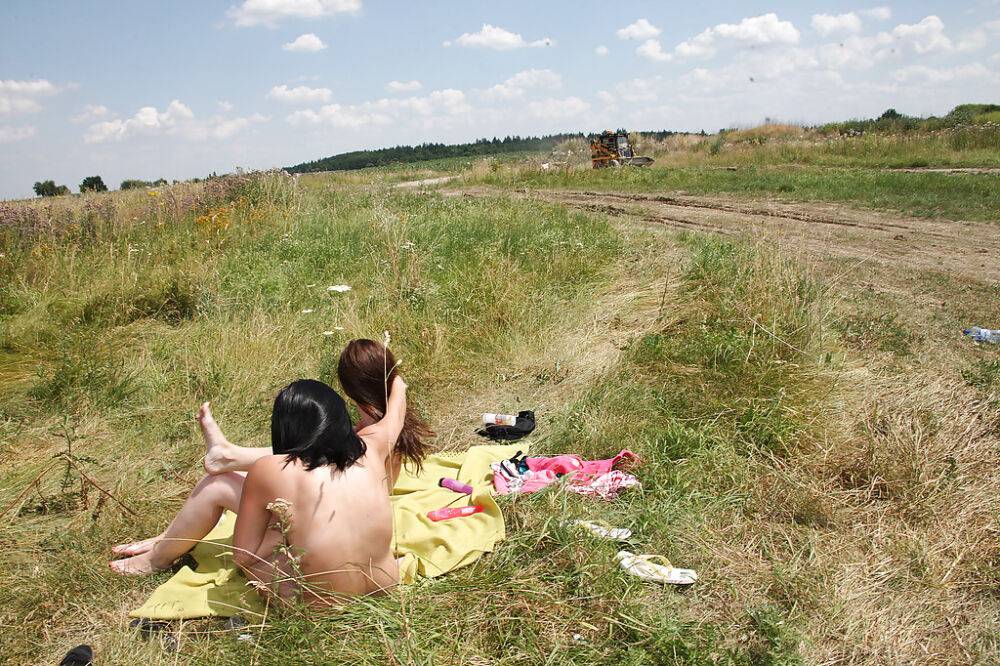 Sweet lesbian teens Jenny G & Terry playing with a jelly toy outdoor - #14