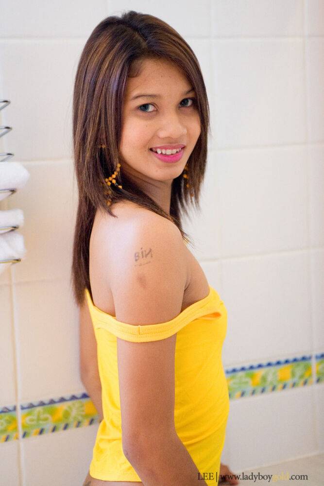 Beautiful young shemale posing in the bathroom and riding tiny butt plug - #3