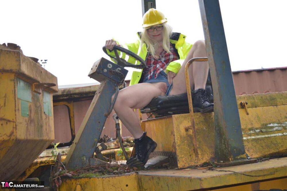 Mature amateur Barby Slut exposes herself on heavy equipment at a job site - #5